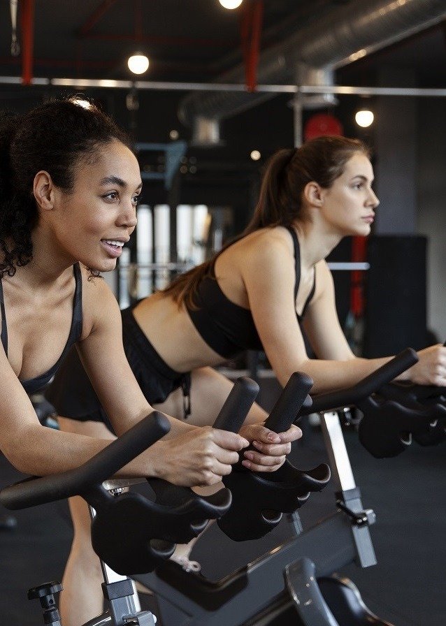 young-women-taking-part-spinning-class